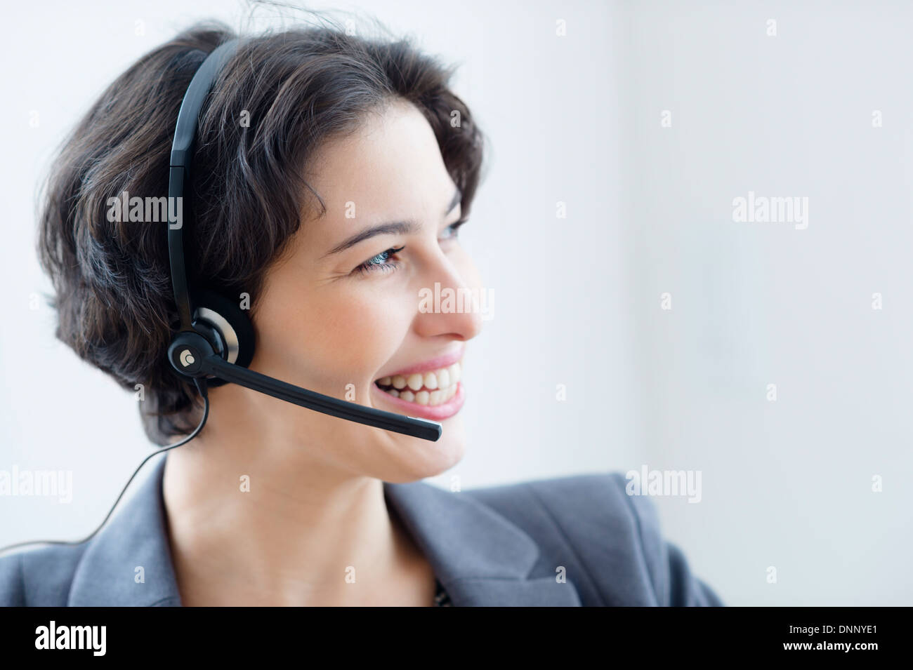 Businesswoman wearing headset Stock Photo