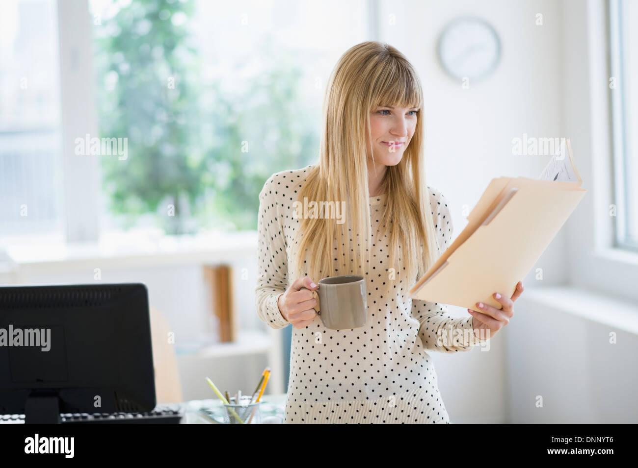 Female designer working in office Stock Photo