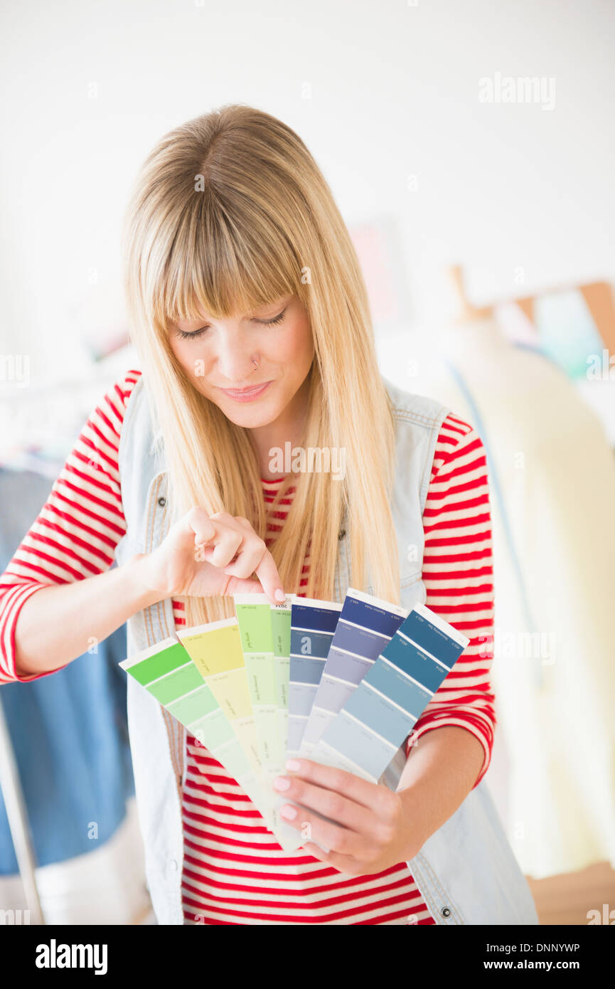 Female designer holding color swatch Stock Photo