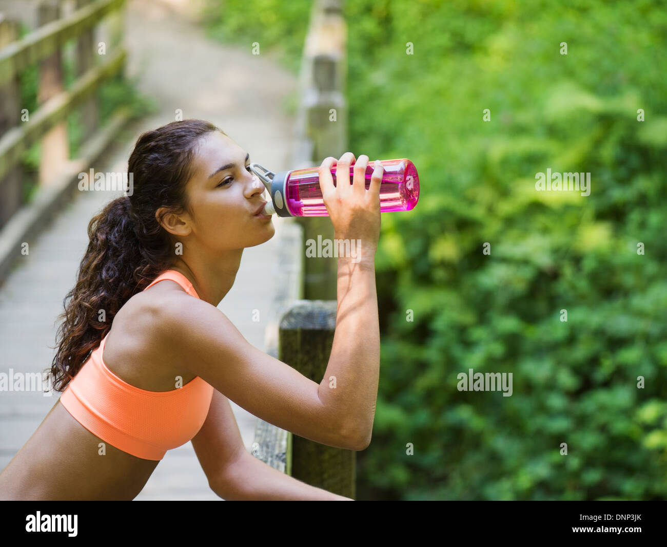 USA, Oregon, Portland, Young women resting, drinking water Stock Photo