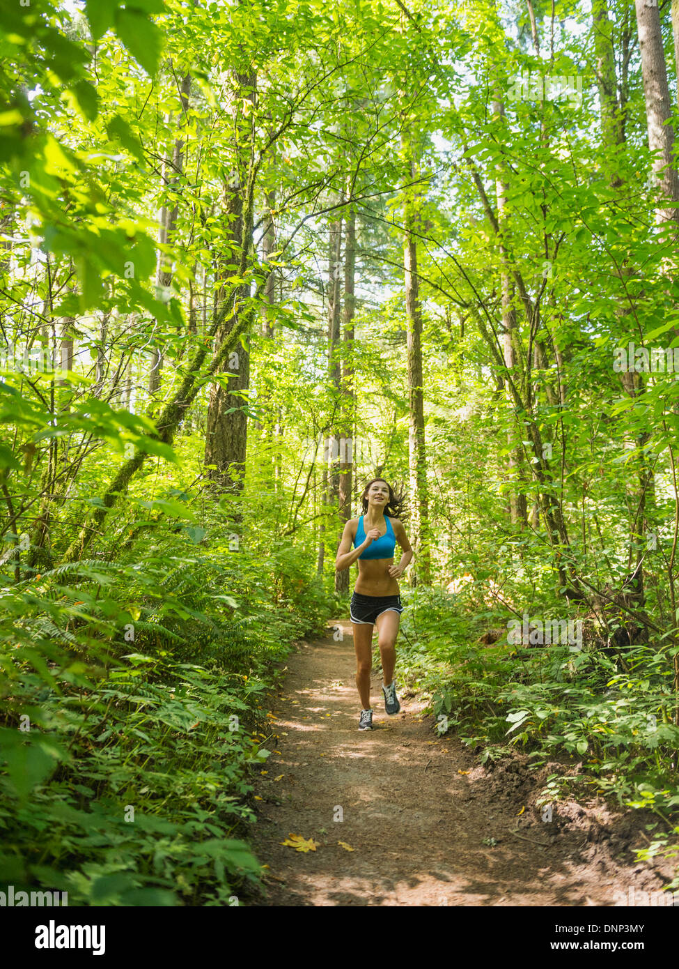 Rear view jogging woman hi-res stock photography and images - Alamy