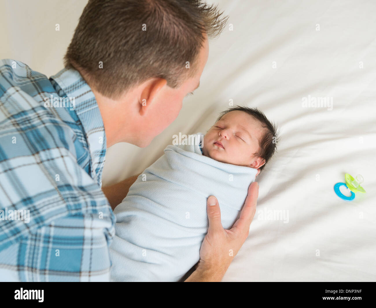 Father holding newborn son (0-11 months) Stock Photo