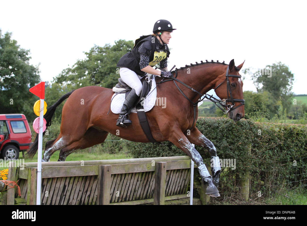 Horse and rider jumping a fence during the cross country phase of a one