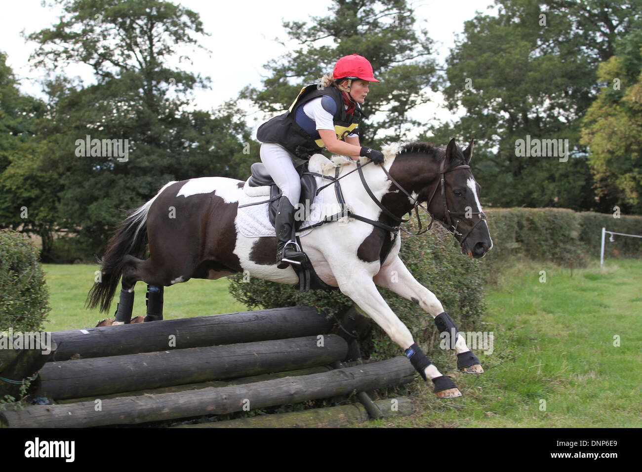 Horse and rider jumping a fence during the cross country phase of a one