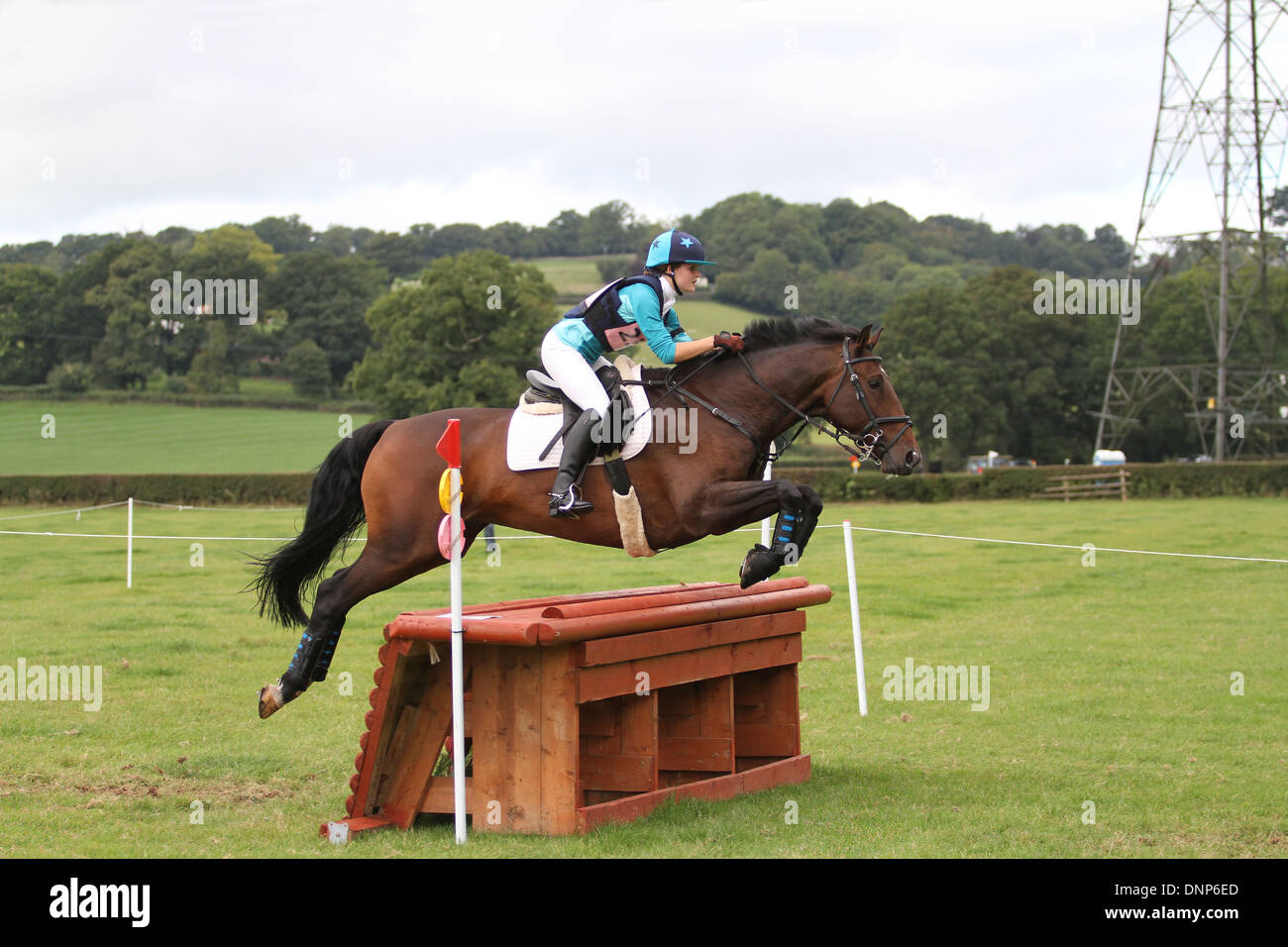 Horse and rider jumping a fence during the cross country phase of a one