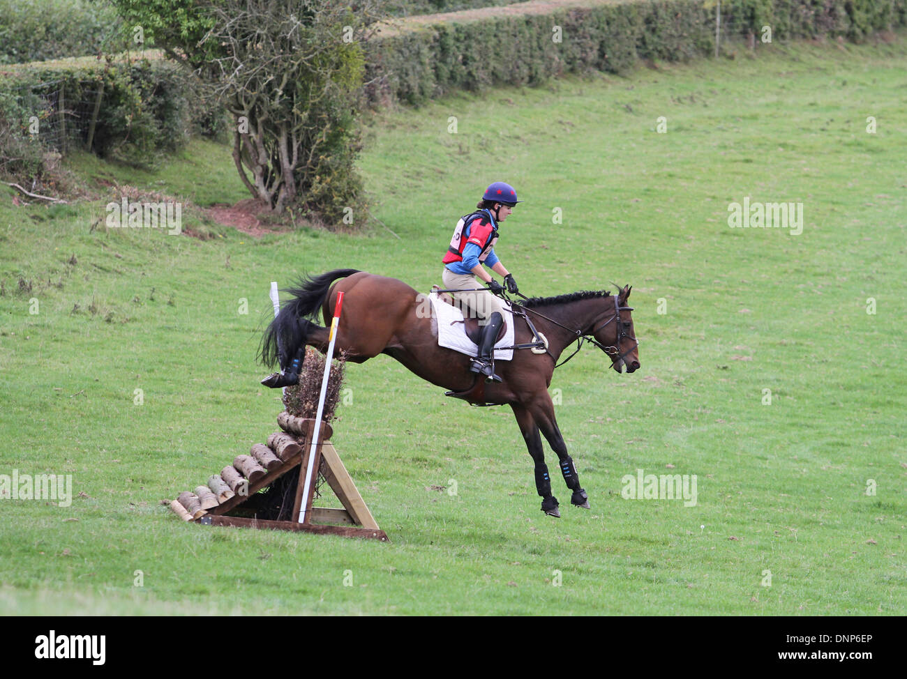 Horse and rider jumping a fence during the cross country phase of a one