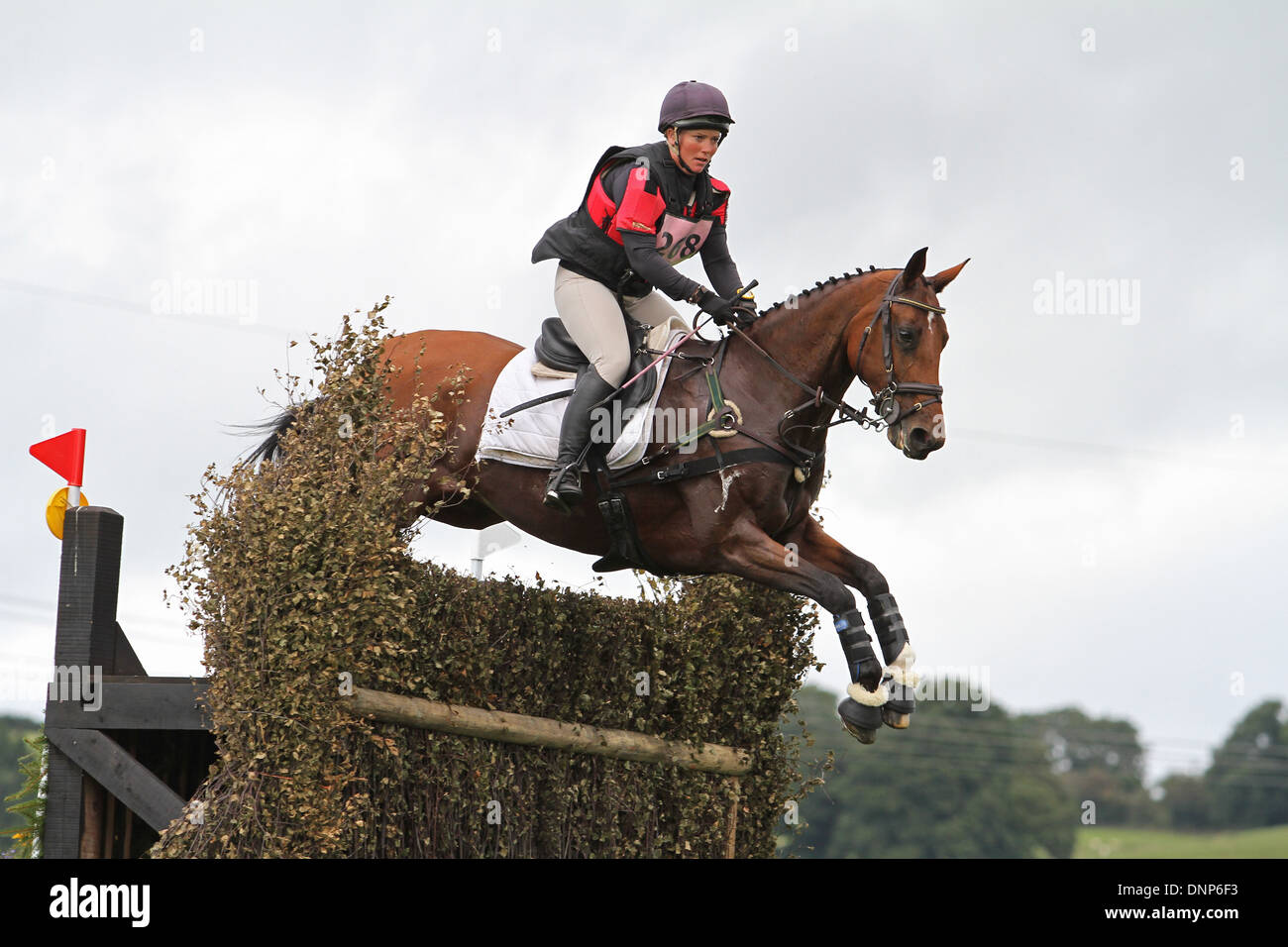 Horse and rider jumping a fence during the cross country phase of a one