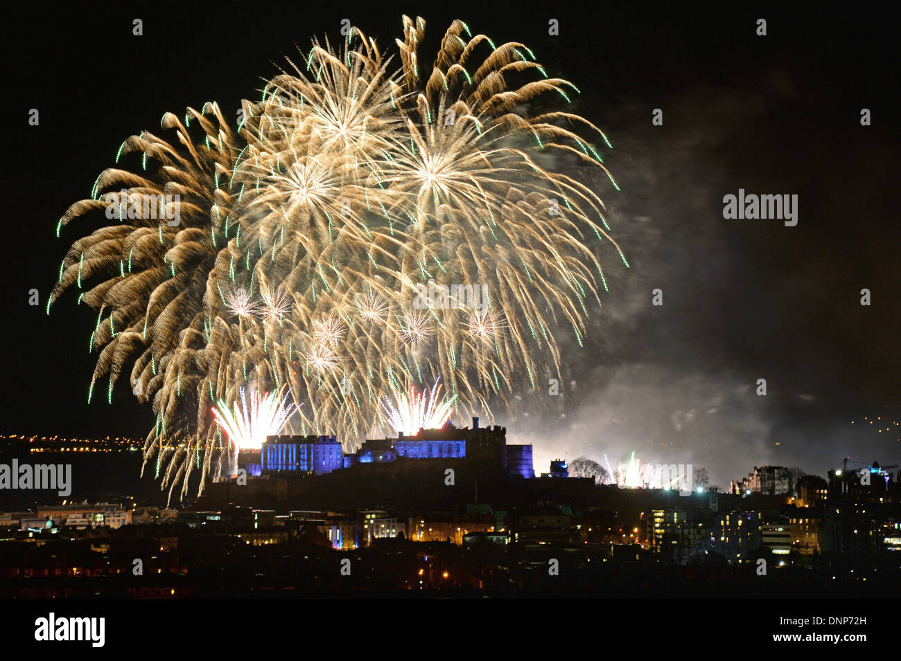 Edinburgh fireworks display above the castle herald's in the New Year 2014 as viewed from Blackford Hill. Stock Photo