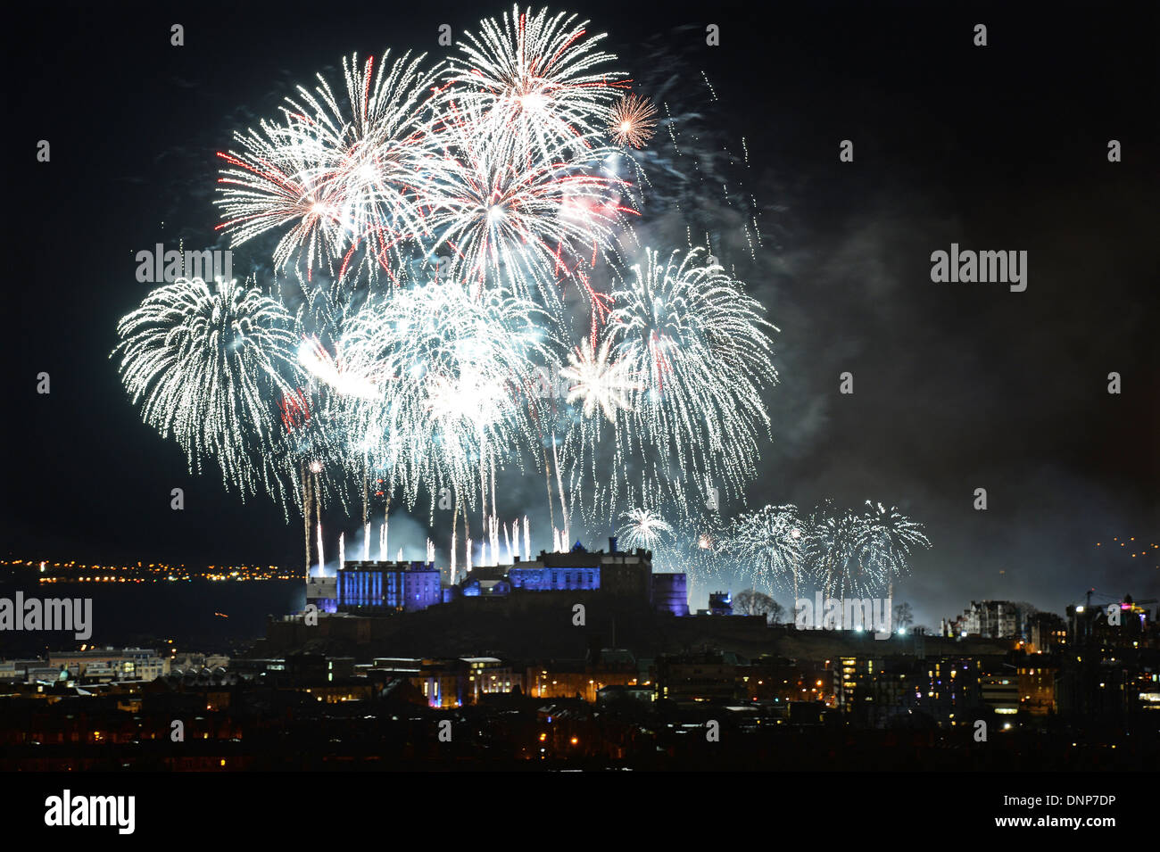 Edinburgh Scotland herald's in the New Year 2014 with a firework's display as viewed from Blackford Hill. Stock Photo