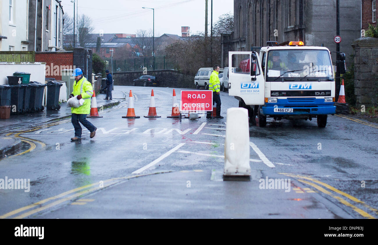 Bristol, UK. 3rd January 2014. Workers close roads and deliver sand bags as a precaution against flooding from the river Avon in Bristol following high tides and heavy rain. 3 January 2014 Credit:  Adam Gasson/Alamy Live News Stock Photo