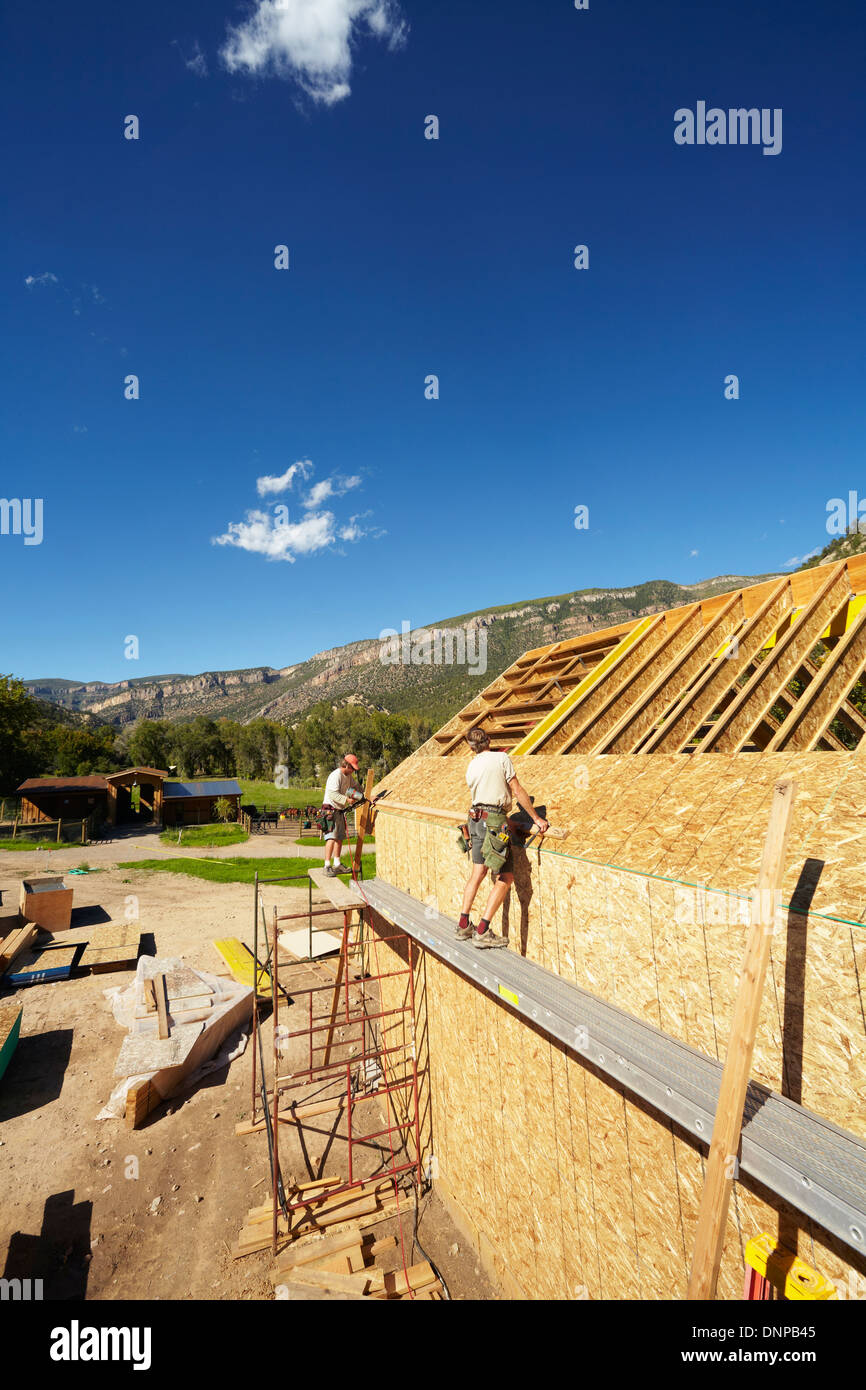 USA, Colorado, Construction workers working on construction site Stock