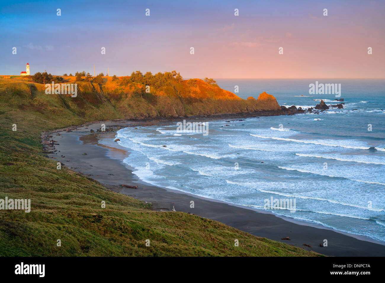 USA, Oregon, Cape Blanco, Landscape with lighthouse in distance Stock