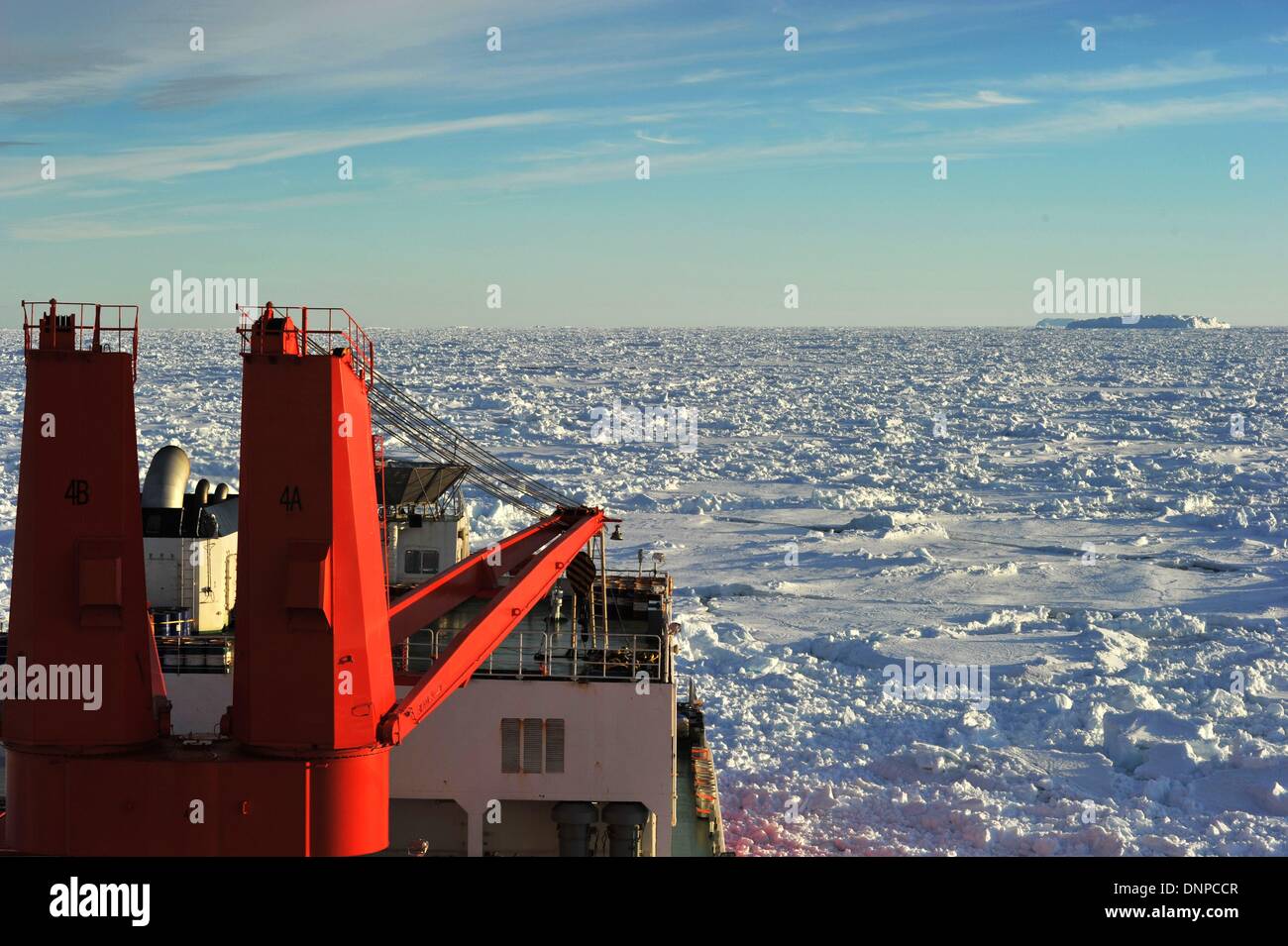 Aboard Xuelong, Antarctica. 3rd Jan, 2014. The Chinese icebreaker Xuelong, or Snow Dragon, anchors in a sea-ice field off Antarctica, Jan. 3, 2014. Xuelong is blocked by thick ice after successfully transferred passengers aboard stranded Russian science vessel MV Akademik Shokalskiy Thursday. Credit:  Zhang Jiansong/Xinhua/Alamy Live News Stock Photo