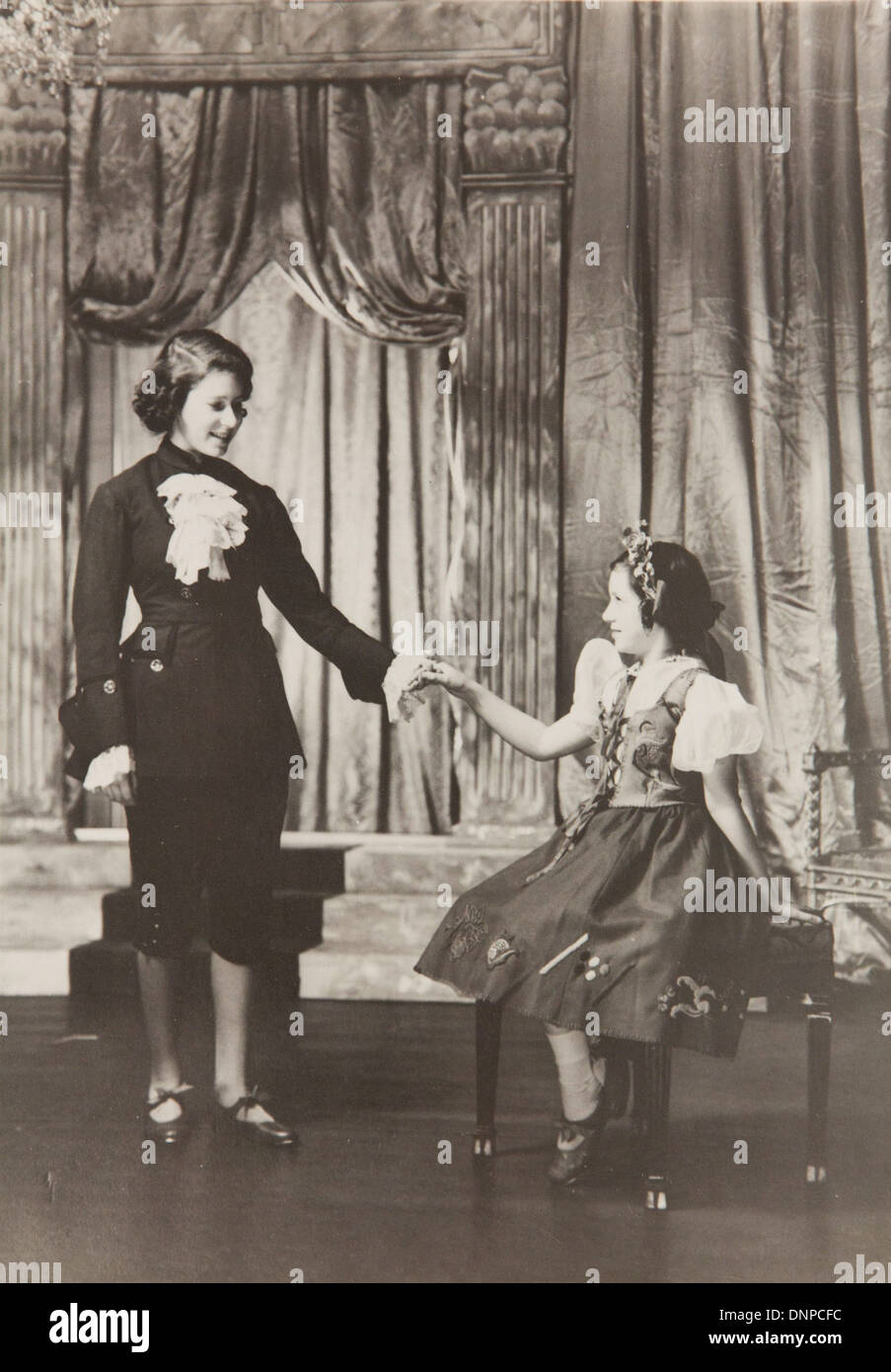 Collect photograph of Princess Elizabeth and Princess Margaret in the play Old Mother Red Riding Boots, 1944. Stock Photo