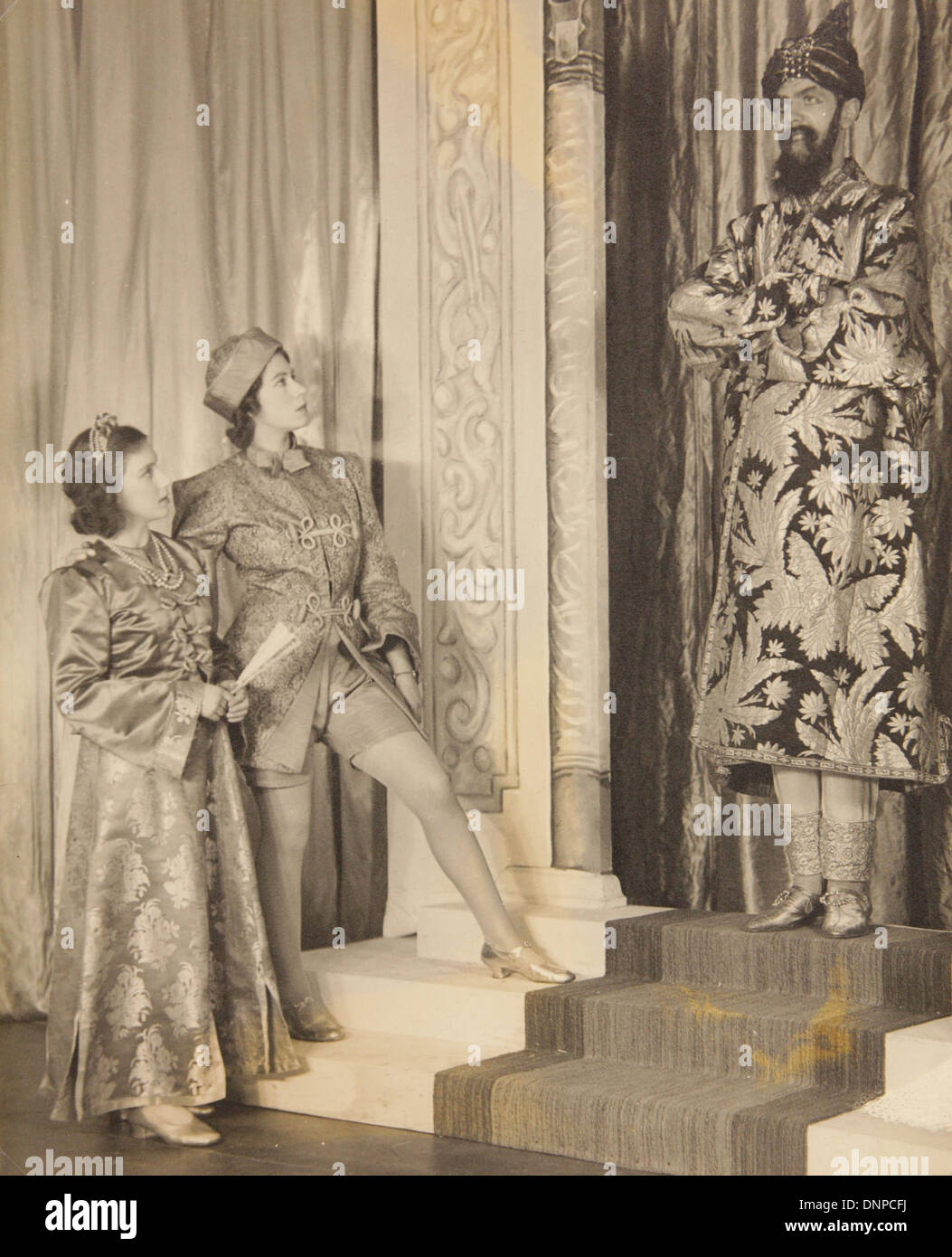 A photograph of Princess Margaret (left) Princess Elizabeth (second left) in the play Aladdin, 1943 Stock Photo