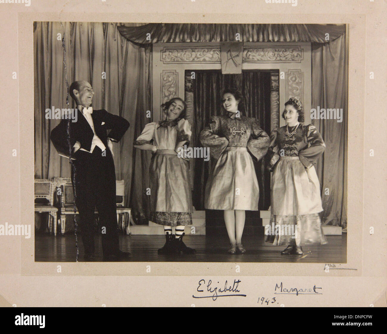 A signed photograph of Princess Margaret (right) and Princess Elizabeth (second from right) in the play Aladdin, 1943 Stock Photo