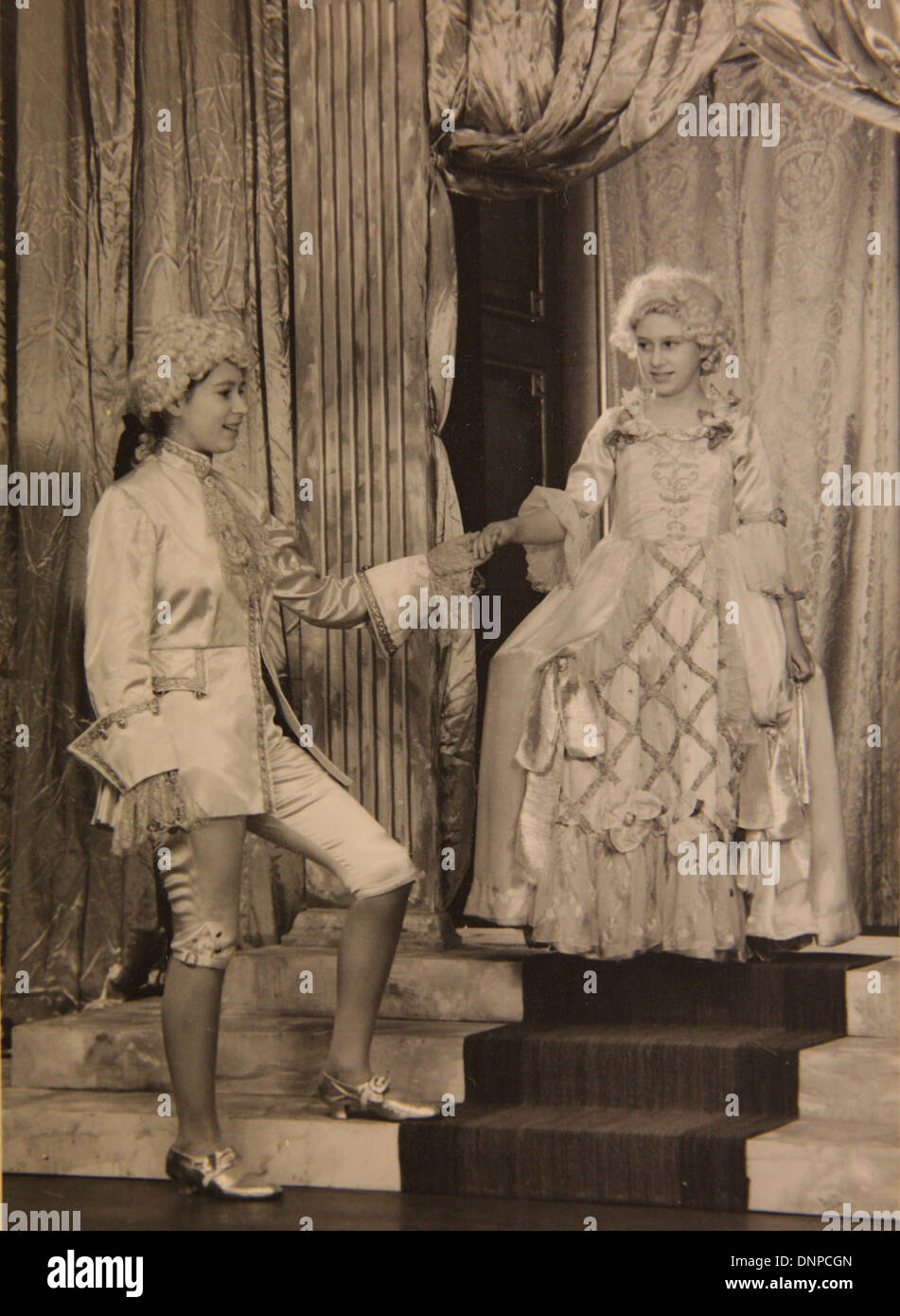 A photograph of Princess Margaret (right) and Princess Elizabeth (left) in the play Aladdin, 1943 Stock Photo