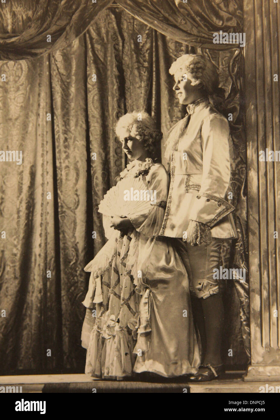 A photograph of Princess Margaret (left) and Princess Elizabeth (right) in the play Aladdin, 1943 Stock Photo