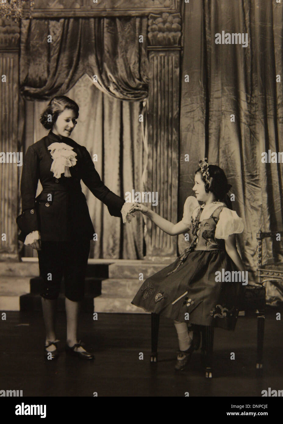 Collect photograph of Princess Margaret (right) and Princess Elizabeth (left) in the play Cinderella, 1941 Stock Photo