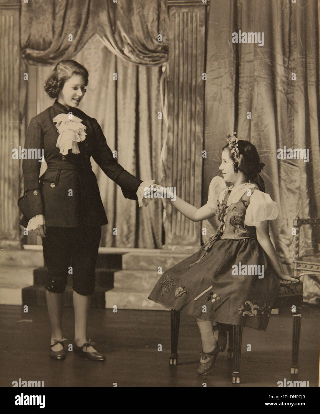 Collect photograph of Princess Elizabeth (left) and Princess Margaret (right) in the play Cinderella, 1941 Stock Photo