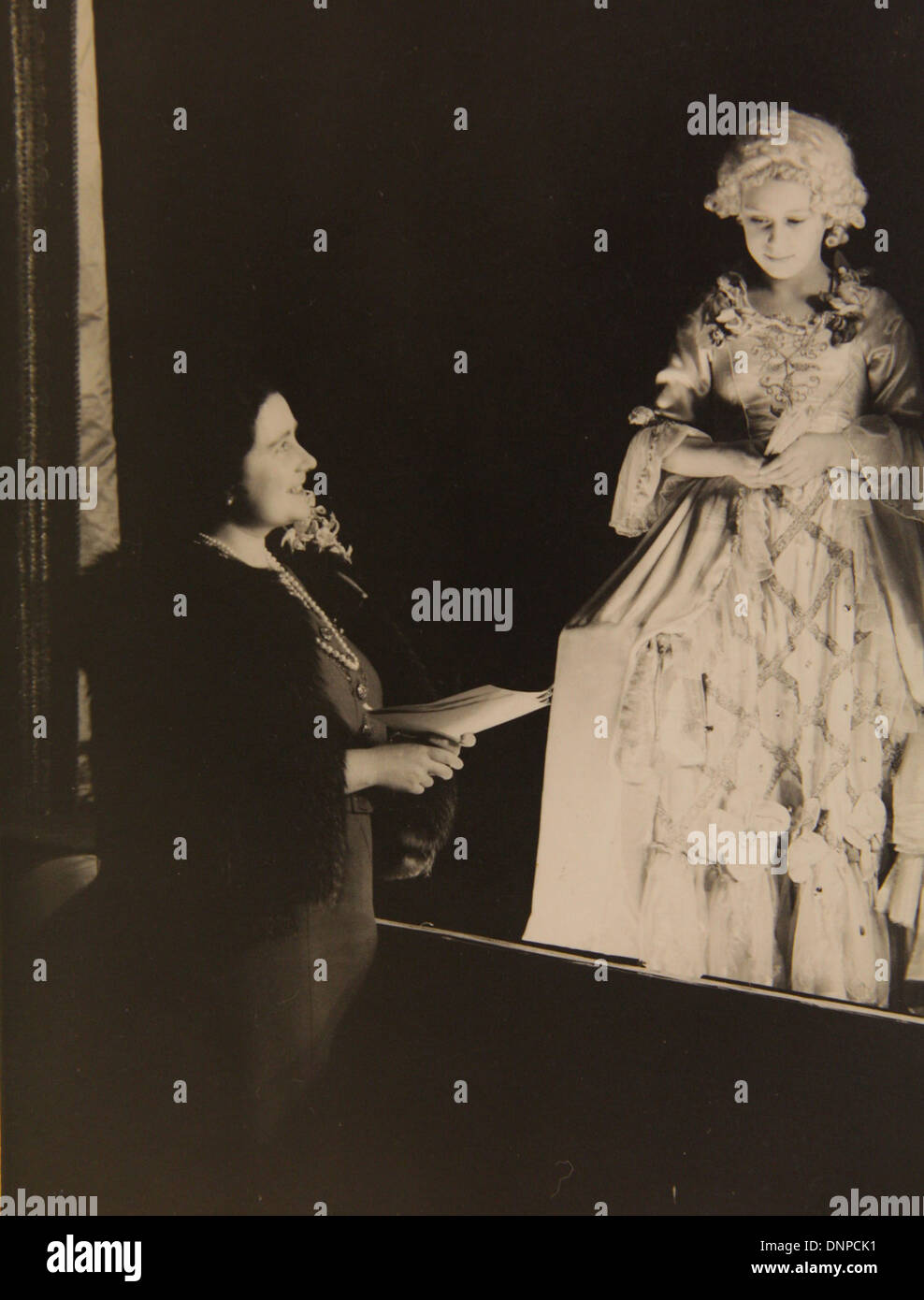 Collect photograph of Princess Margaret (right) meeting her mother during the play Cinderella, 1941 Stock Photo