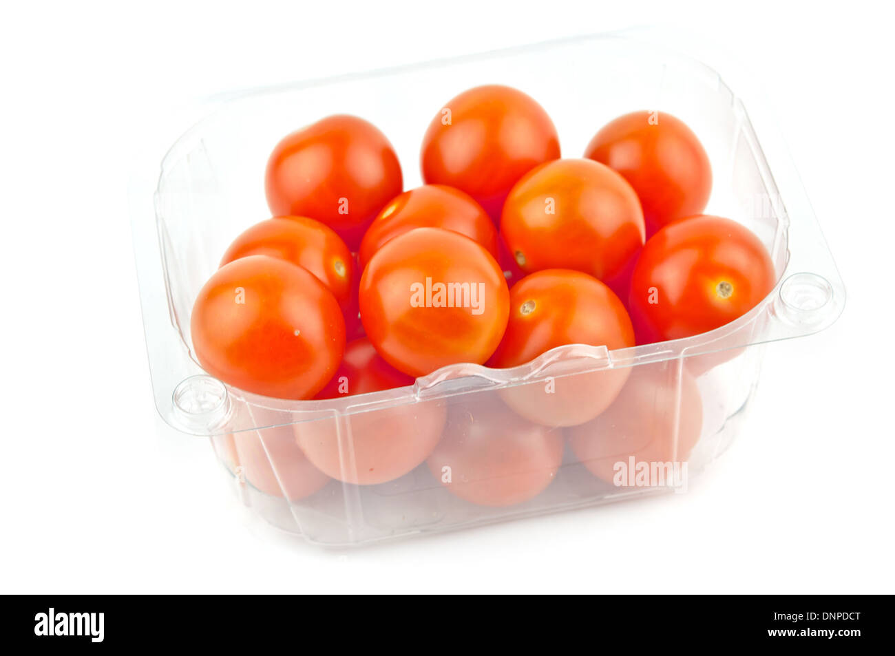 cherry Tomatoes In Plastic Retail Supermarket Packaging isolated on white background Stock Photo