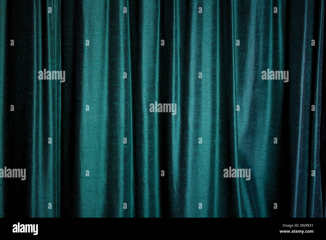 Background Of Dark Green Velvet Curtains Highlighted As They Catch
