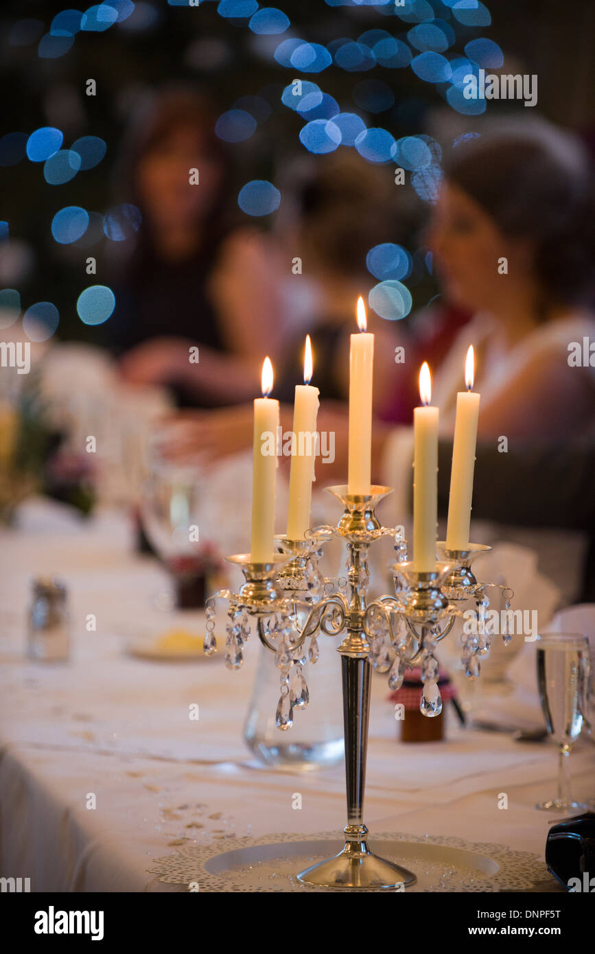 Candlestick at a wedding reception, function, occasion, bit of a do, people, happy, celebration, flame, danger, hazard Stock Photo