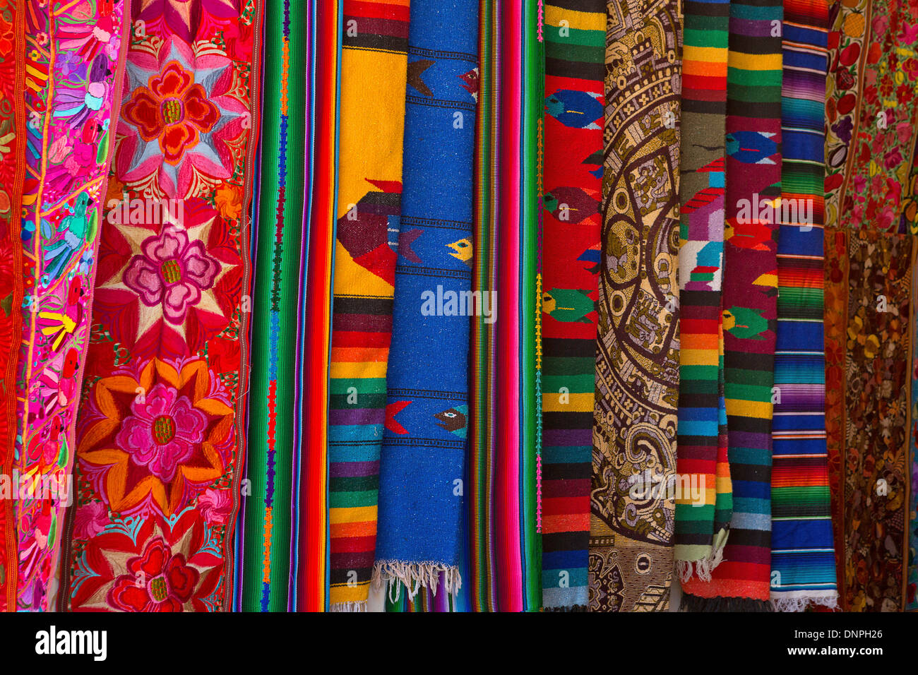 Colorful material hanging in a shop in Cabo San Lucas, Mexico. Baja Stock Photo
