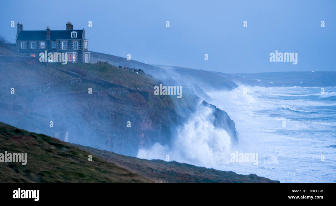 Huge storm waves batter the cliffs Cornish coast at Porthleven Stock Photo