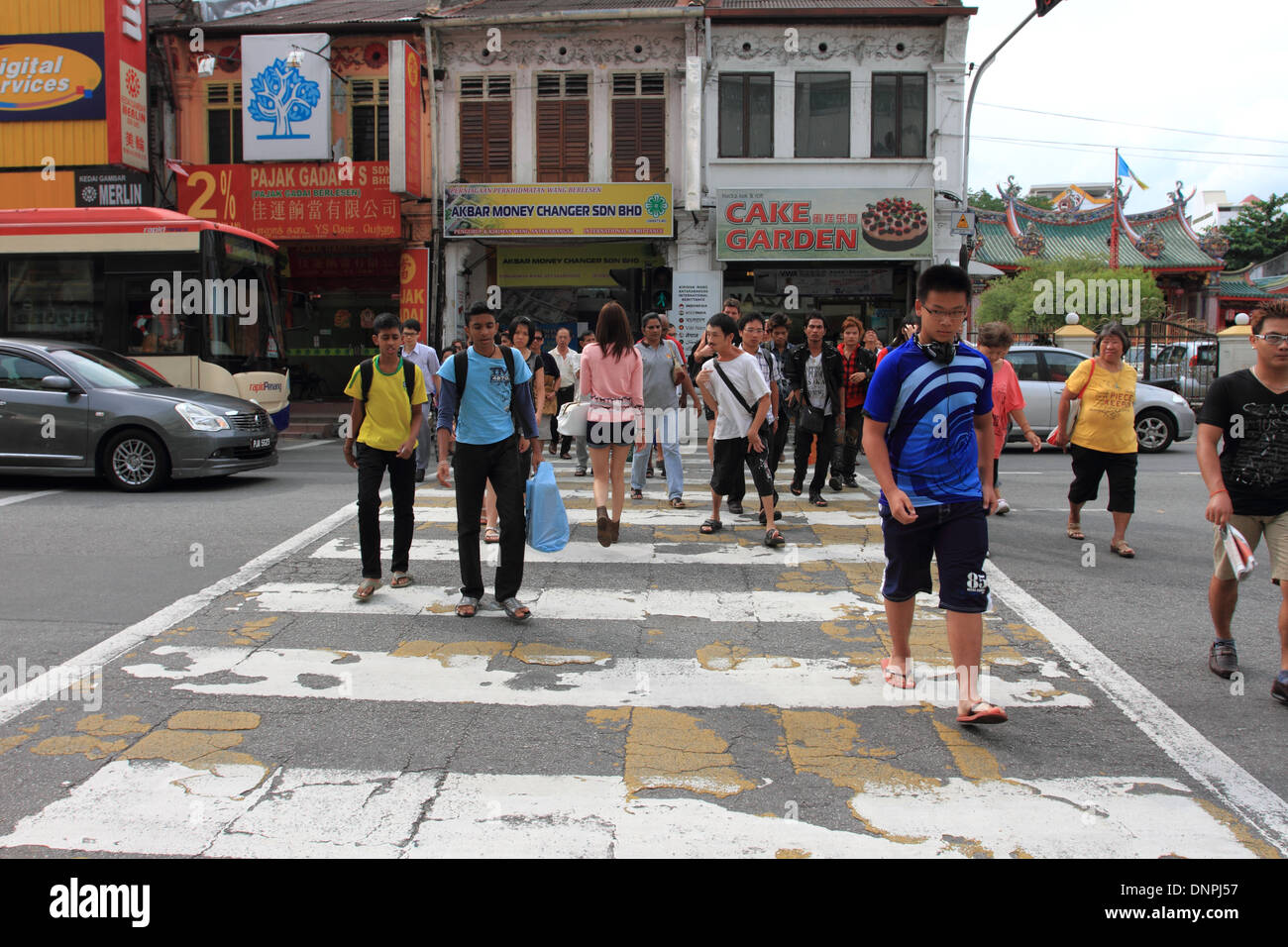 traffic, people crossing at cross road,old komtar shopping centre, penang,malaysia Stock Photo