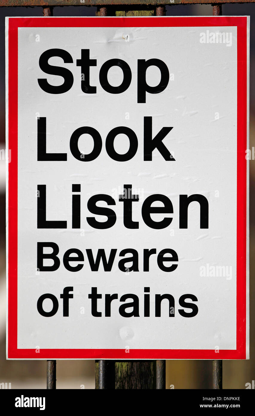 https://c8.alamy.com/comp/DNPKKE/warning-sign-instructing-people-to-stop-look-listen-beware-of-trains-DNPKKE.jpg