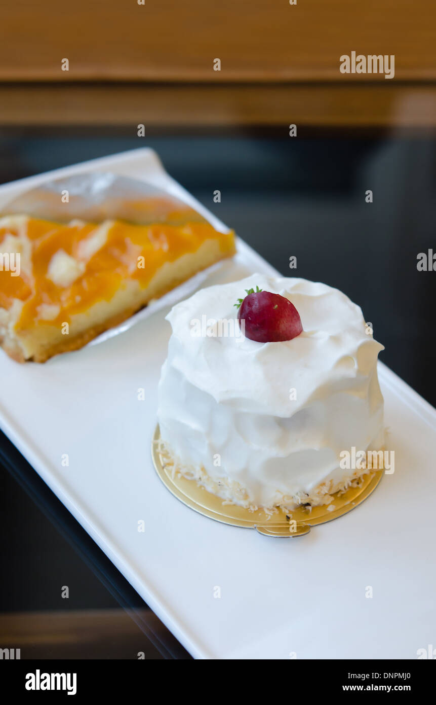 young coconut cake with fresh cream and red grape Stock Photo