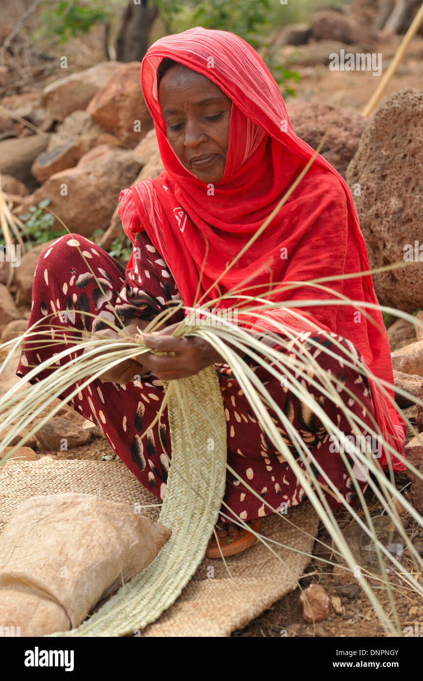 Djiboutian woman making baskets wicker in a village in northern Djibouti, Horn of Africa Stock Photo