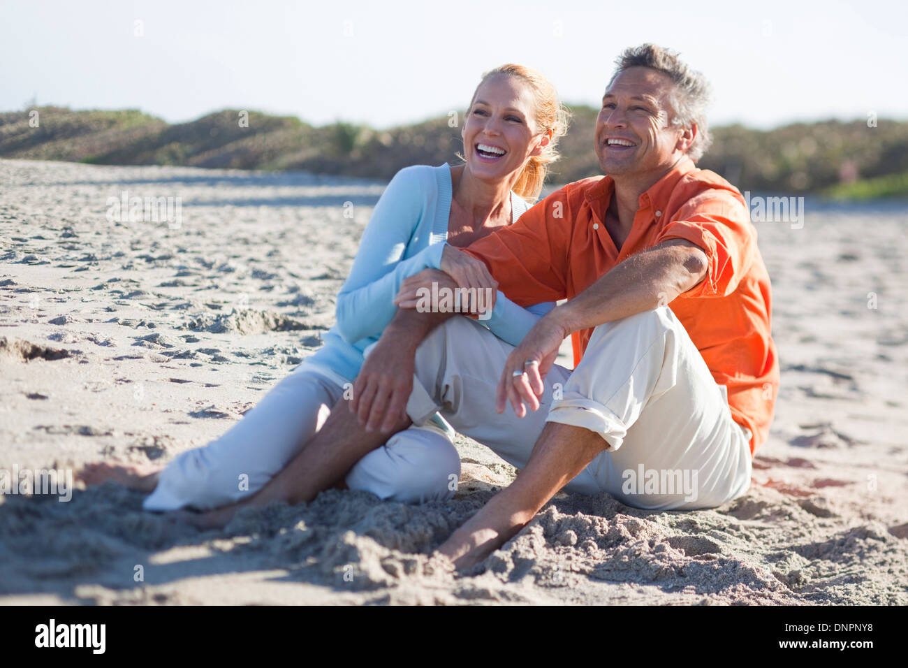 Mature Couple Sitting on Beach, Jupiter, Palm Beach County, Florida, USA Stock Photo