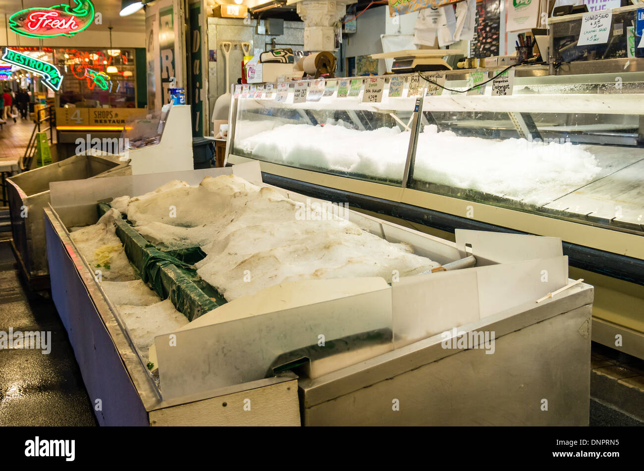 Ice filled display cases at a fish monger stall Pike Place Market Seattle, Washington, USA Stock Photo