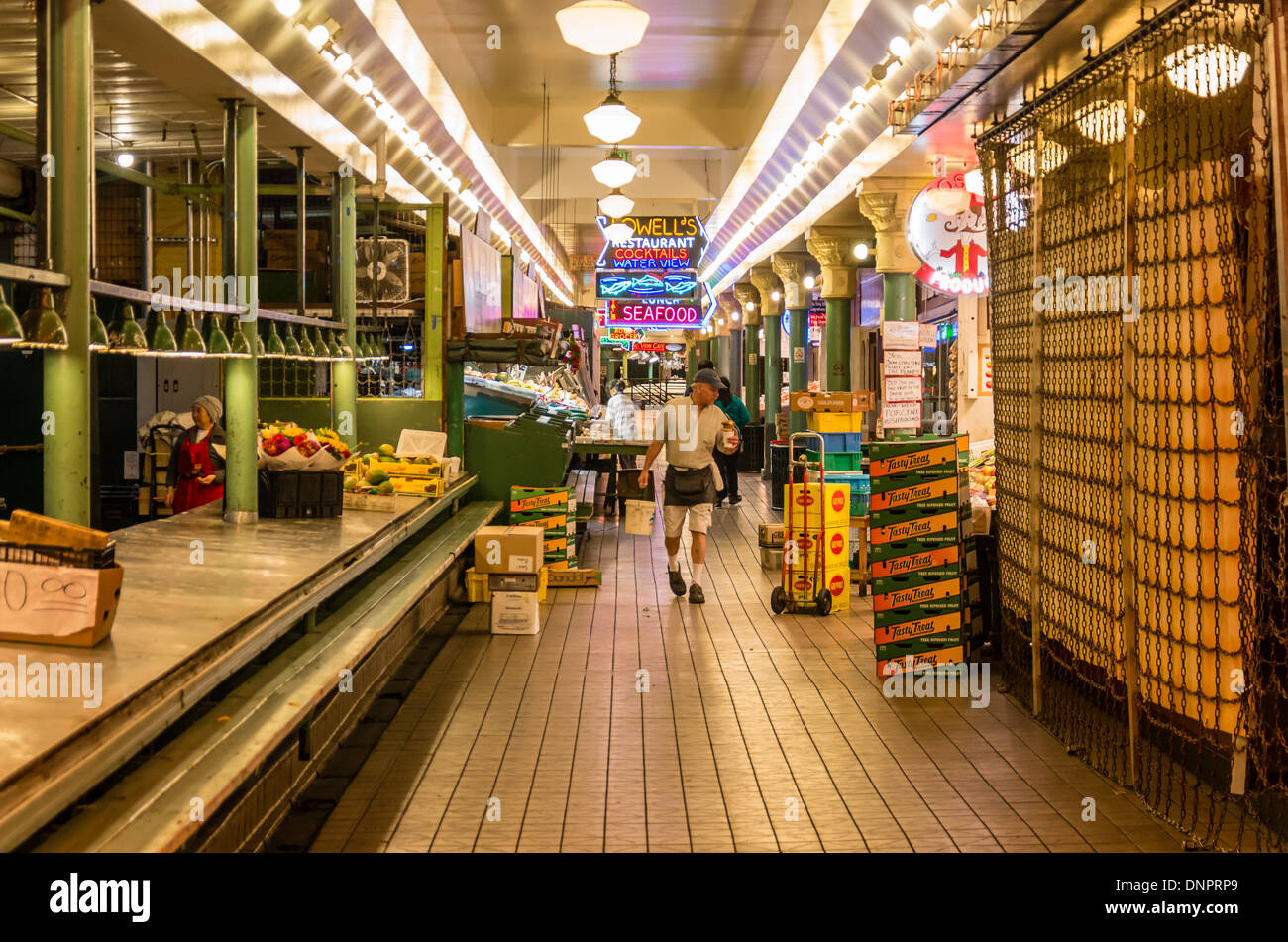 Vendors stocking stalls before opening Pike Place Market Seattle, Washington, USA Stock Photo