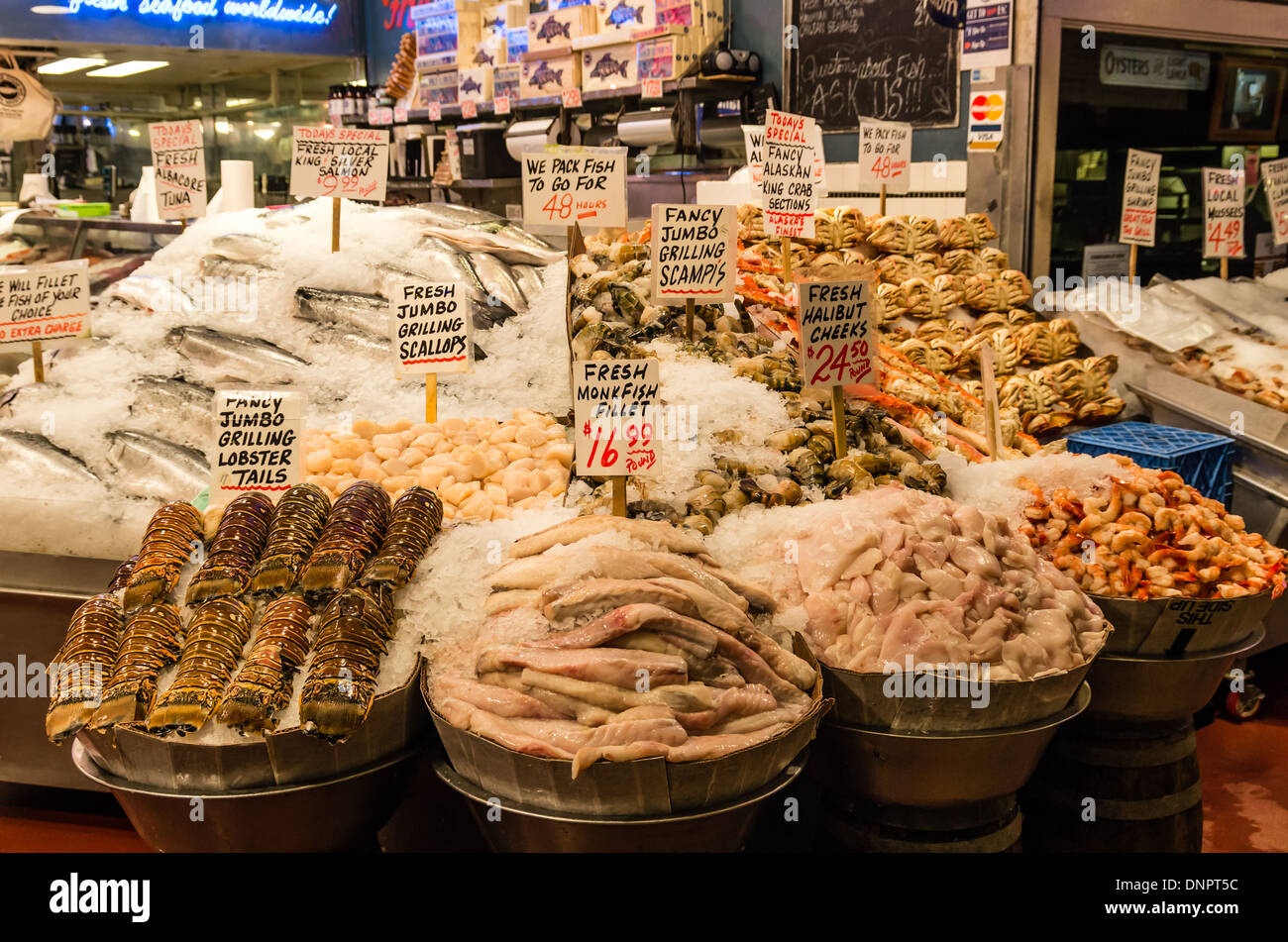 Seafood on ice at a fish monger's market stall Pike Place Market Seattle, Washington, USA Stock Photo