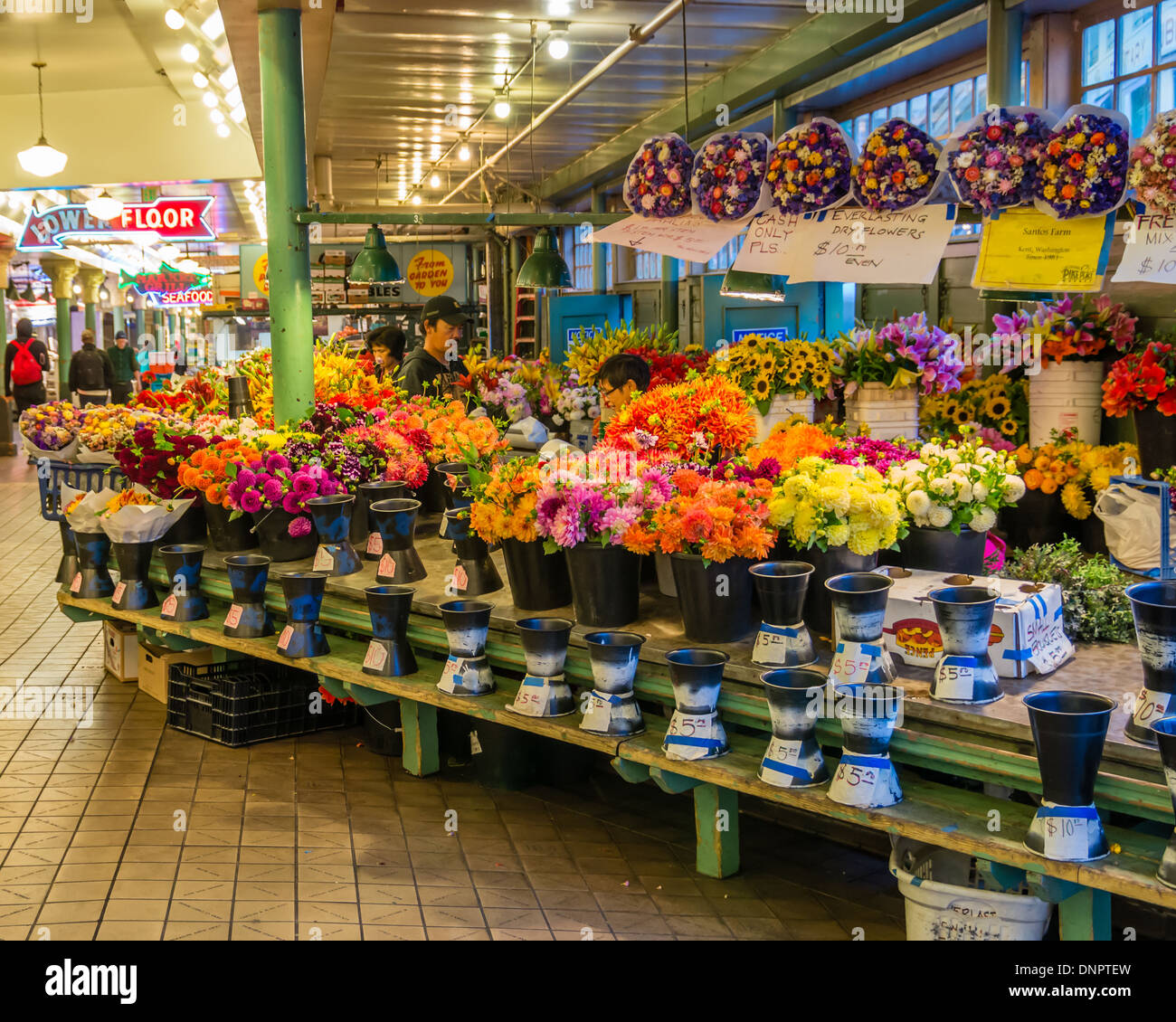 Flower market stall with fresh flowers on display Pike Place Market Seattle, Washington, USA Stock Photo