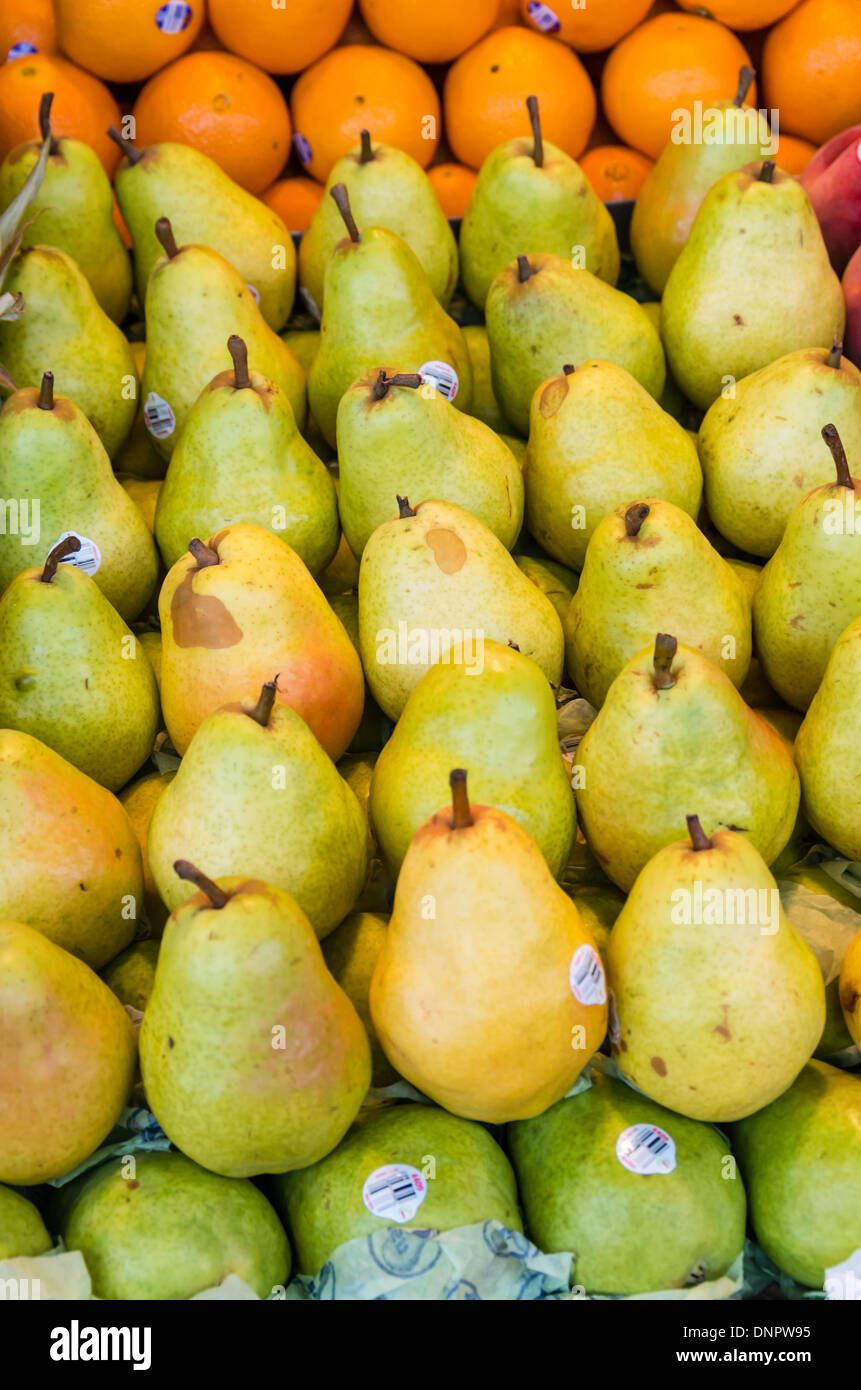 Bartlett pears carefully arranged for display in a market stall Pike Place Market Seattle, Washington, USA Stock Photo
