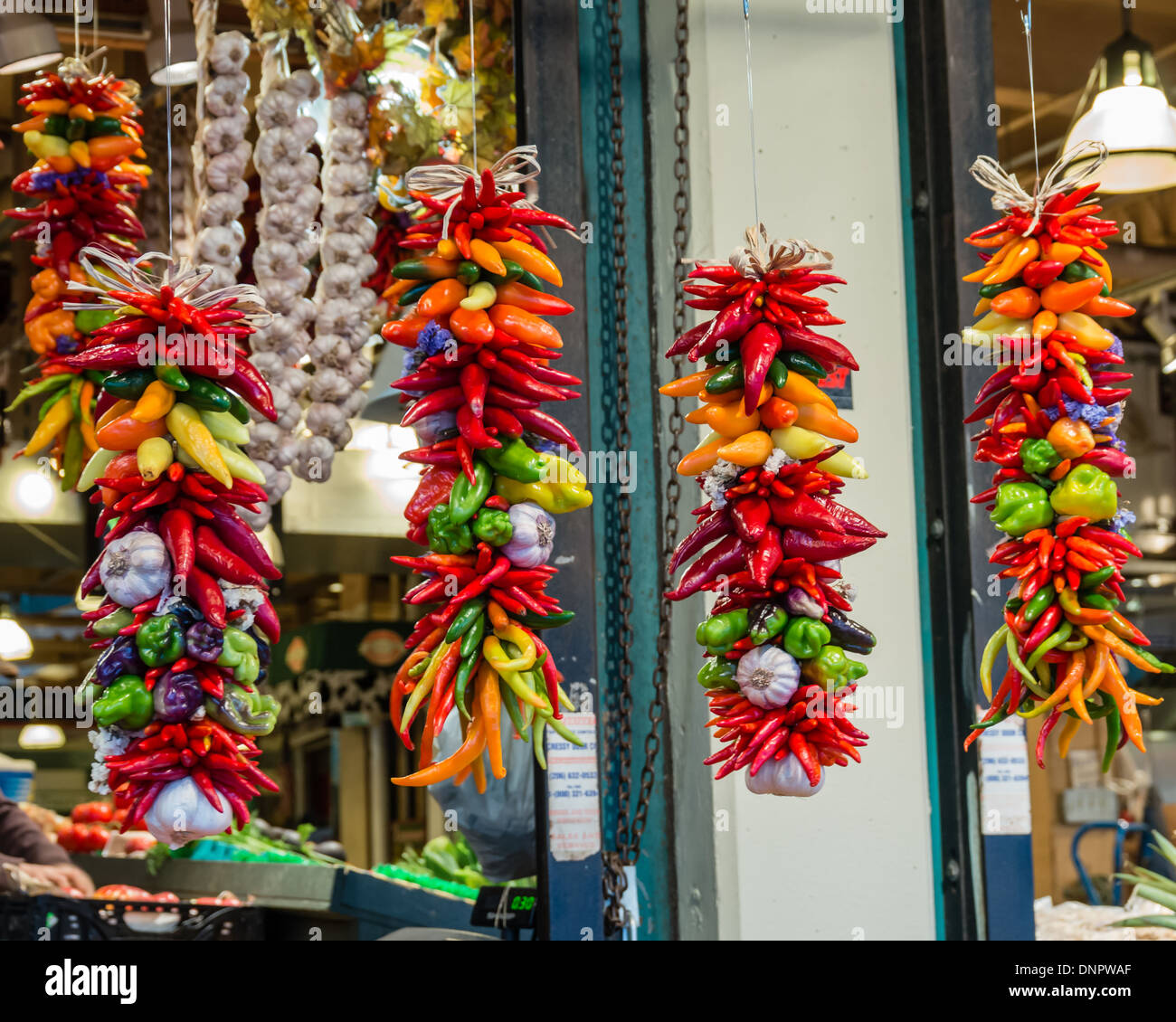 Display of peppers and garlic hanging to dry in a market stall Pike Place Market Seattle, Washington, USA Stock Photo