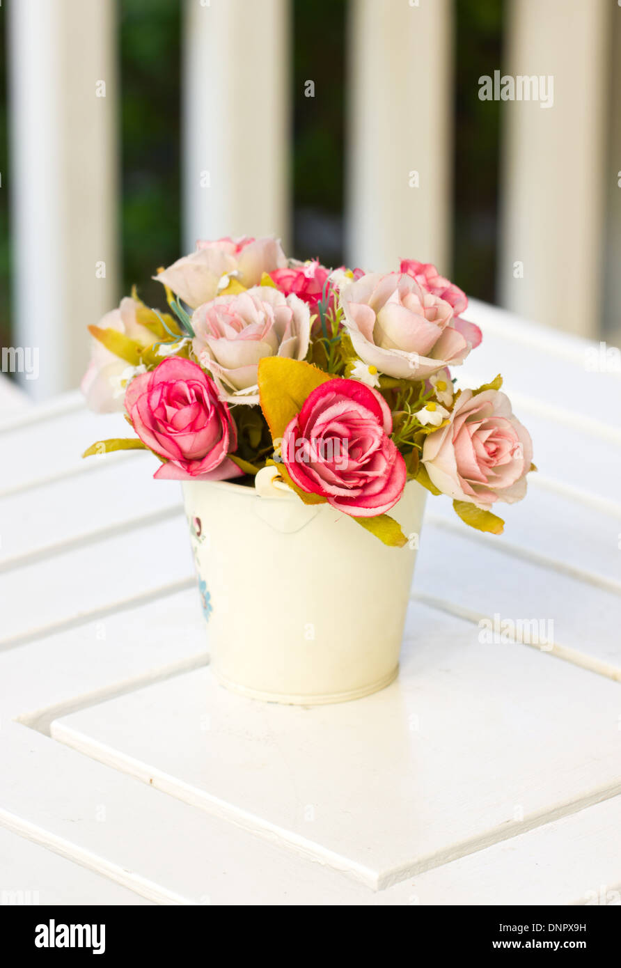 Artificial flower in metal vase Stock Photo Alamy