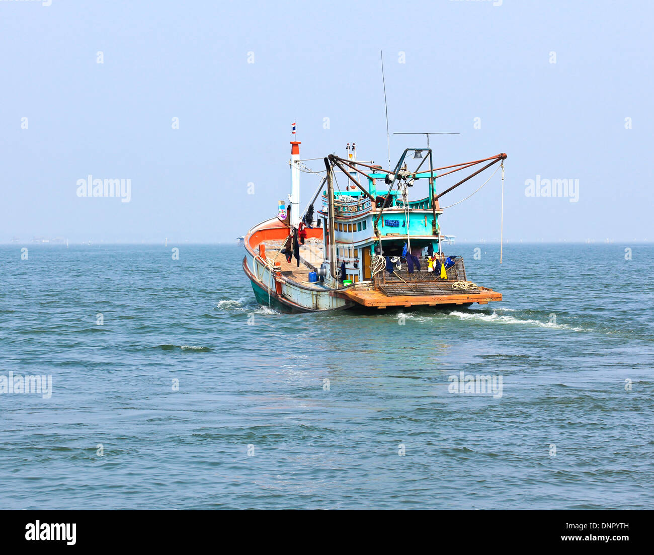 Wooden fishing boat on sea Stock Photo - Alamy
