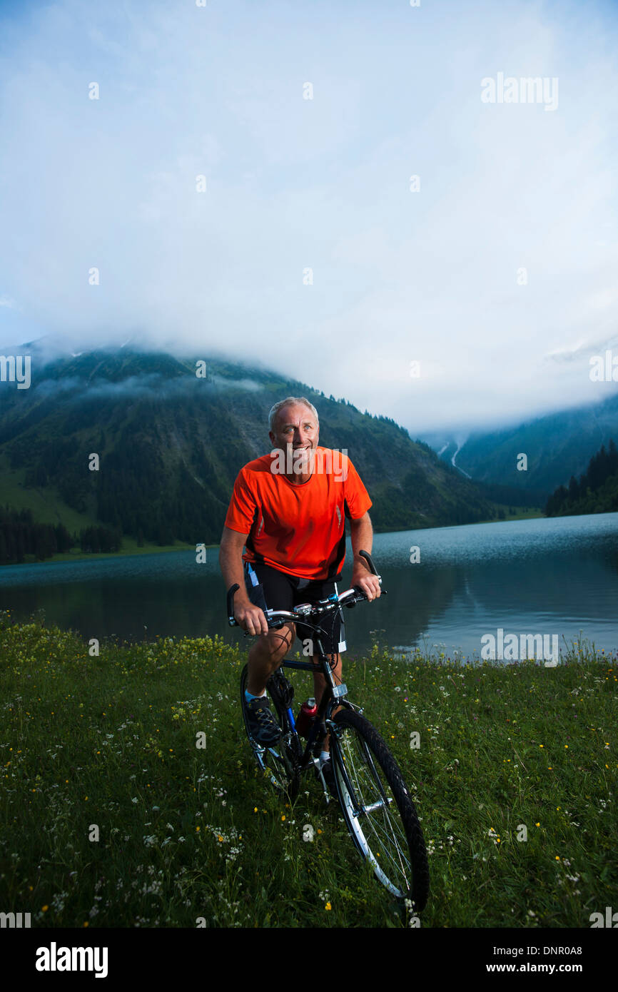 Mature Man Riding Mountain Bike by Vilsalpsee, Tannheim Valley, Tyrol,  Austria Stock Photo - Alamy