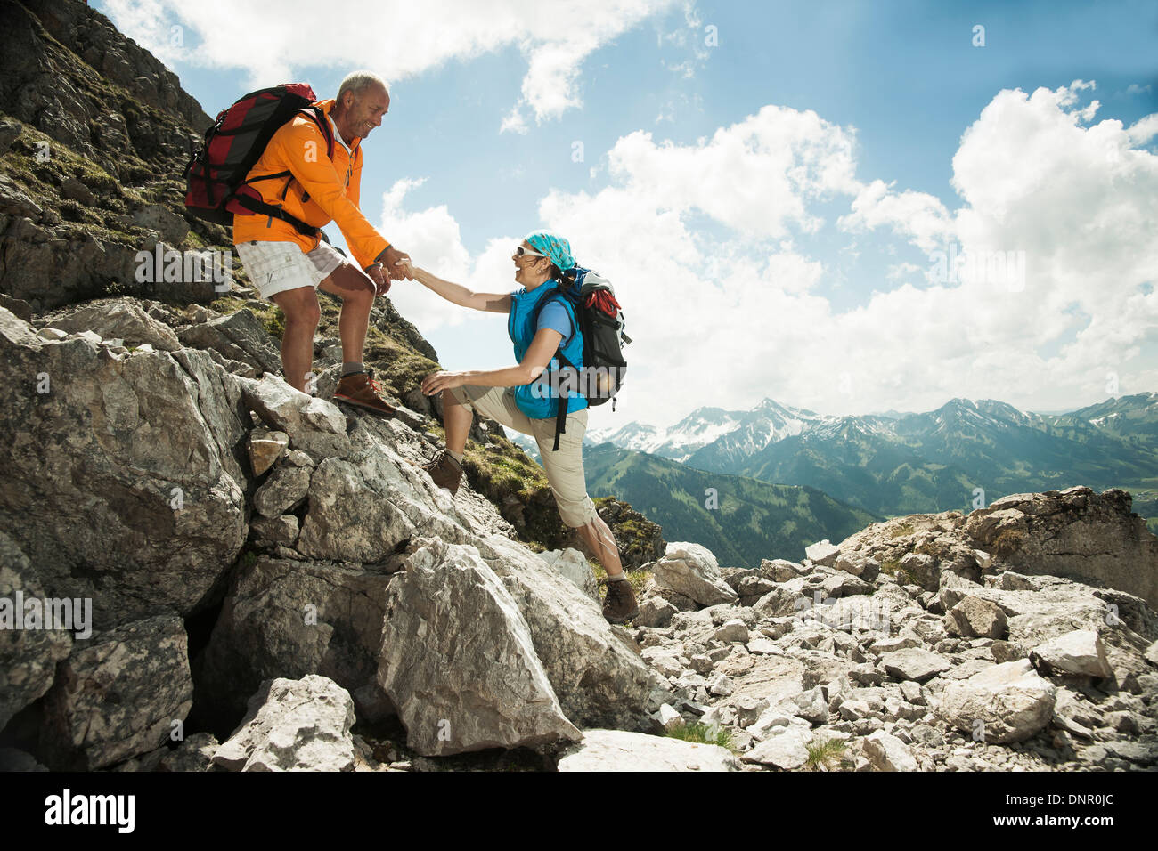 Mature couple hiking in mountains, Tannheim Valley, Austria Stock Photo
