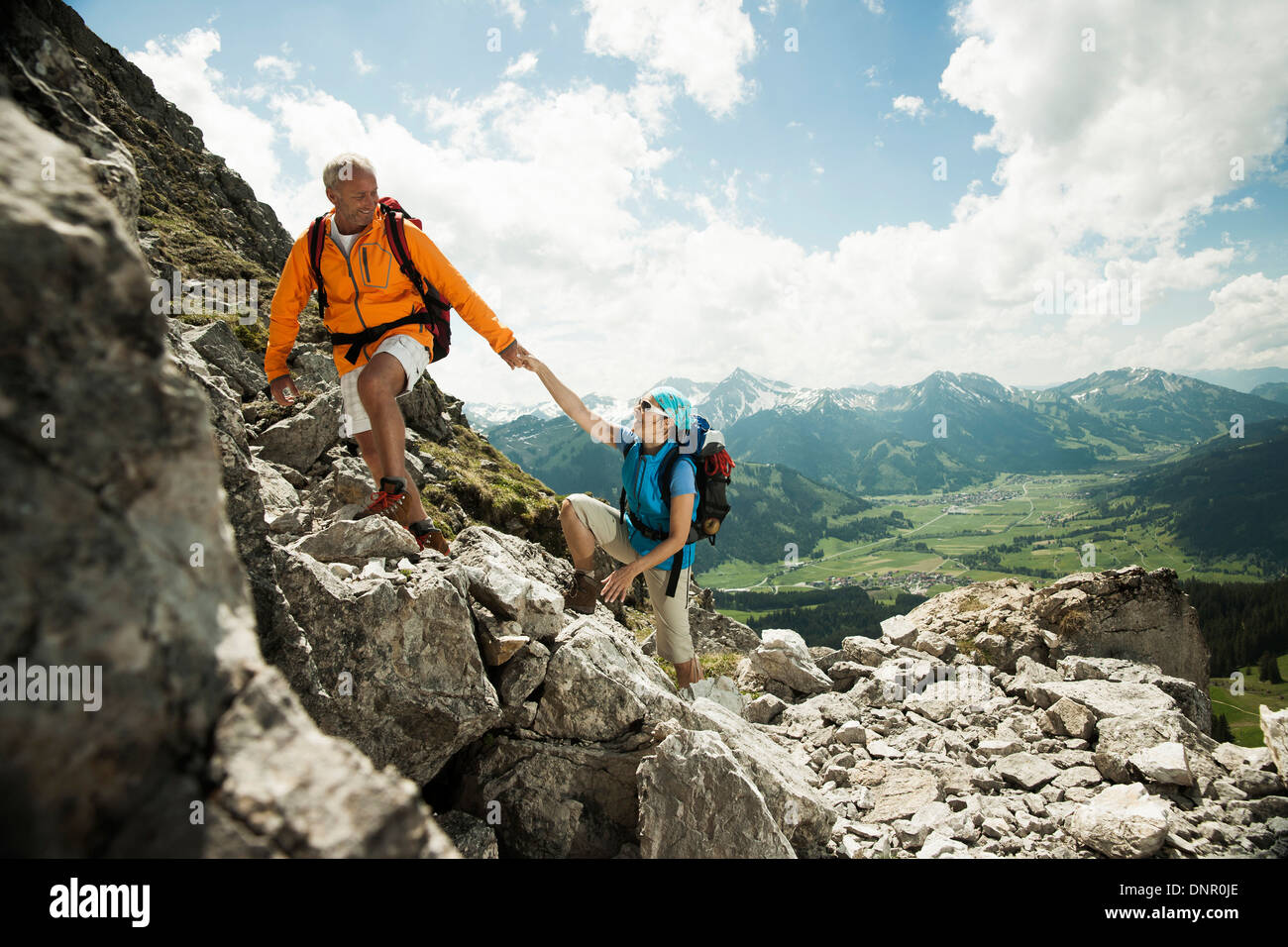 Mature couple hiking in mountains, Tannheim Valley, Austria Stock Photo
