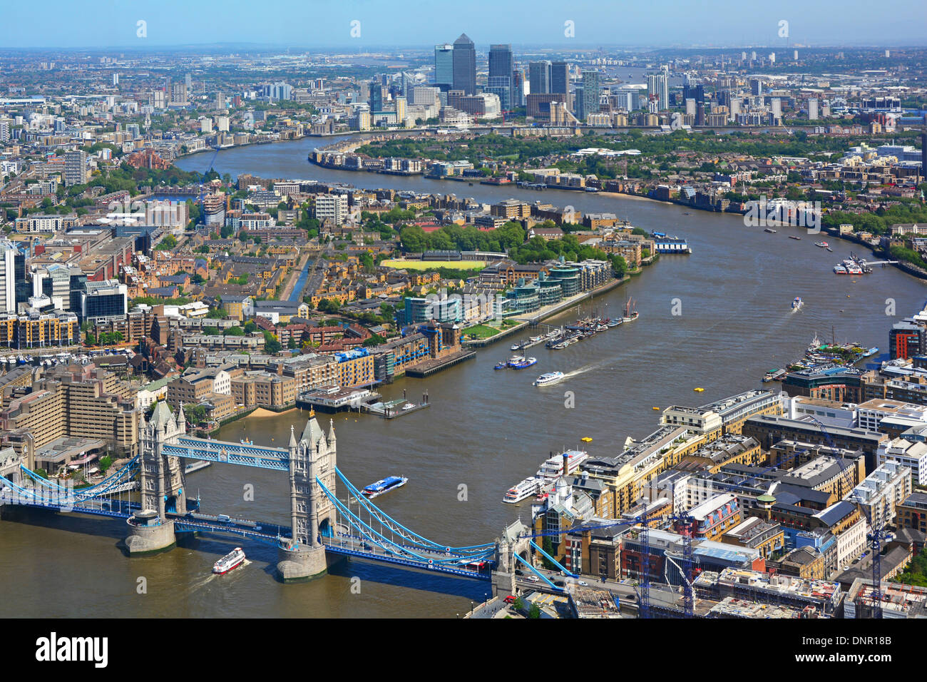 Aerial urban London landscape view from Shard high tide River Thames starts from iconic Tower Bridge toward Canary Wharf skyline landmarks England UK Stock Photo