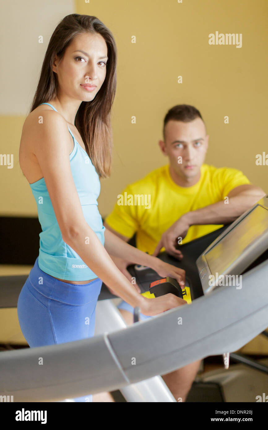 Young man and woman in the gym Stock Photo - Alamy