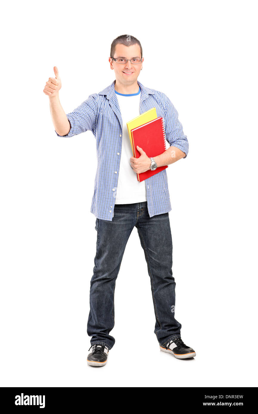Full length portrait of male student with books giving thumb up Stock ...