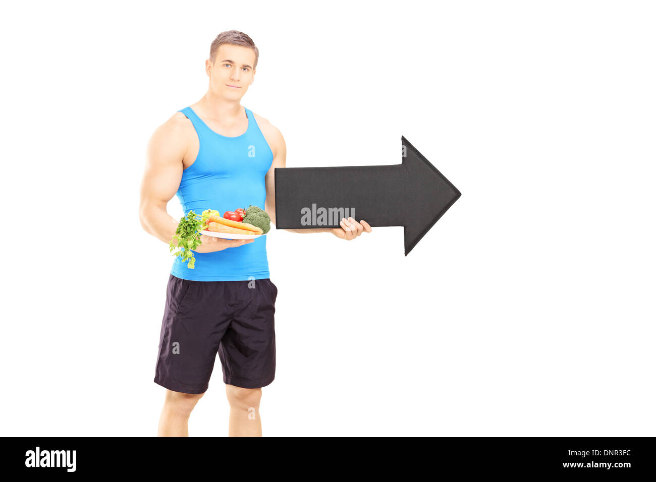 Gym instructor holding dish and big black arrow Stock Photo